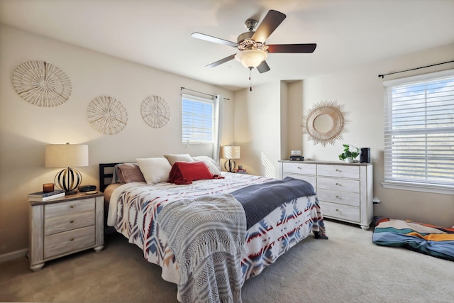 carpeted bedroom featuring a ceiling fan