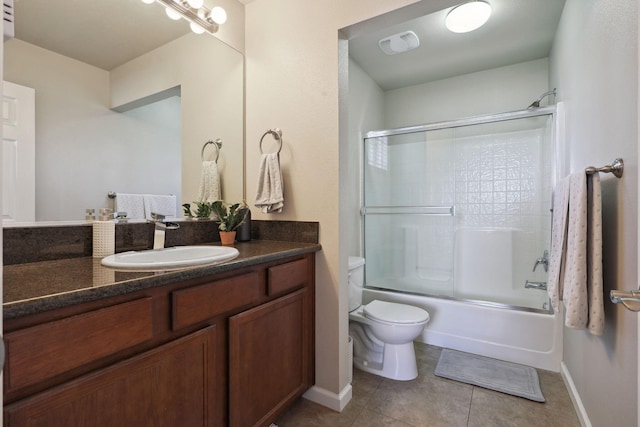 full bathroom featuring vanity, visible vents, tile patterned flooring, toilet, and combined bath / shower with glass door