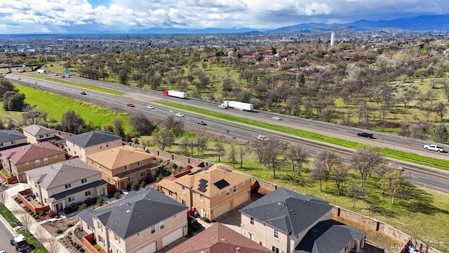 birds eye view of property with a residential view and a mountain view