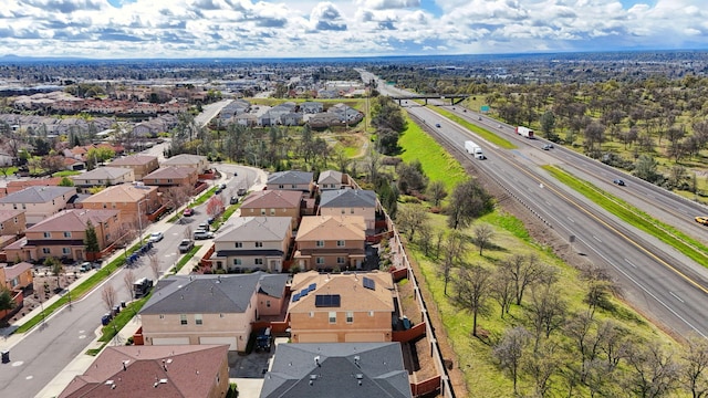 birds eye view of property with a residential view