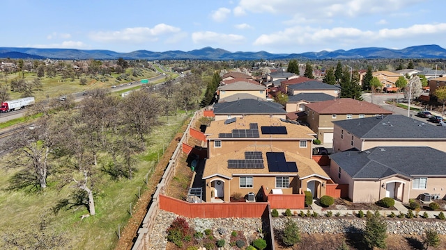 birds eye view of property featuring a mountain view and a residential view