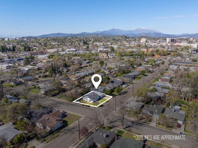 birds eye view of property featuring a mountain view