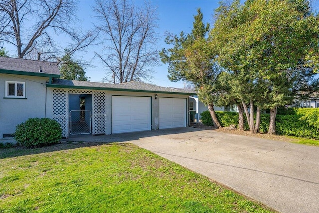 garage with concrete driveway