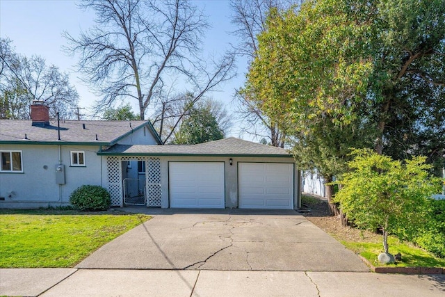 single story home featuring concrete driveway, a front yard, stucco siding, a chimney, and a garage