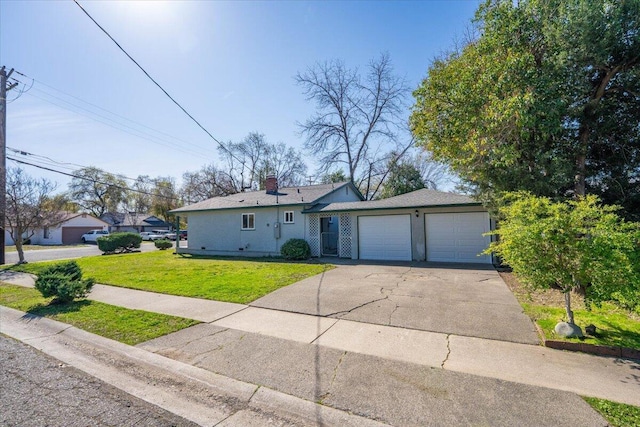 ranch-style home with a chimney, concrete driveway, a front yard, and a garage