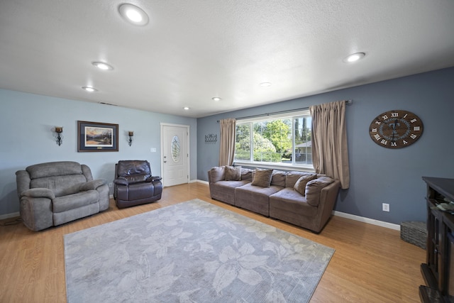 7100 Aldo Way, Anderson, CA 96007 - living room featuring wood finished floors, baseboards, and recessed lighting