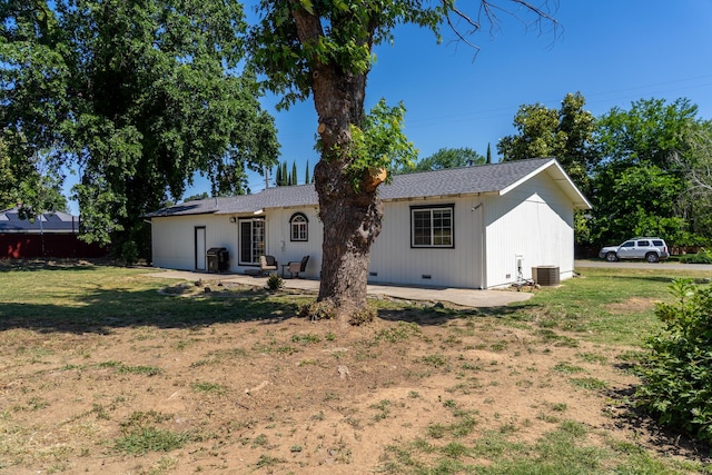 7100 Aldo Way, Anderson, CA 96007 - rear view of house with a lawn, central air condition unit, and a patio