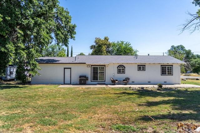 7100 Aldo Way, Anderson, CA 96007 - back of property featuring a patio, a yard, and roof with shingles