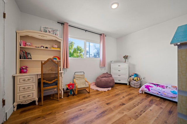 bedroom featuring wood finished floors