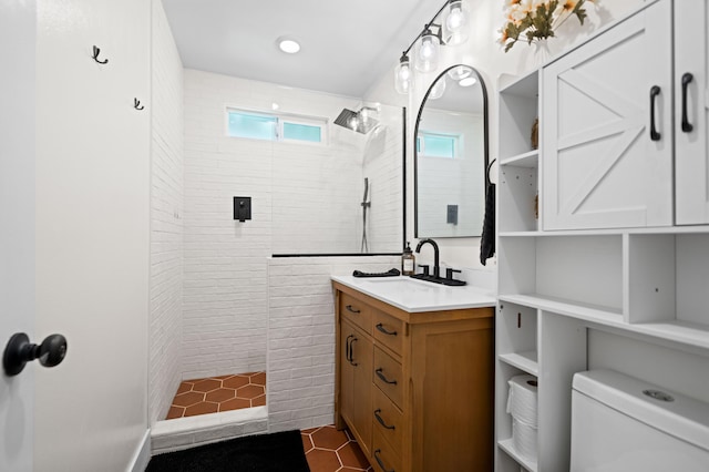 full bath featuring vanity, toilet, and walk in shower