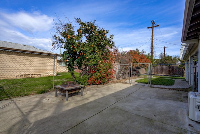 view of patio / terrace featuring a fire pit and fence