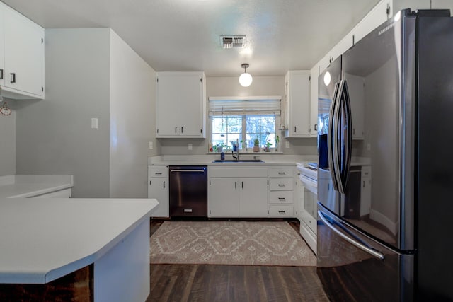 kitchen featuring visible vents, smart refrigerator, stainless steel dishwasher, white electric range, and a sink