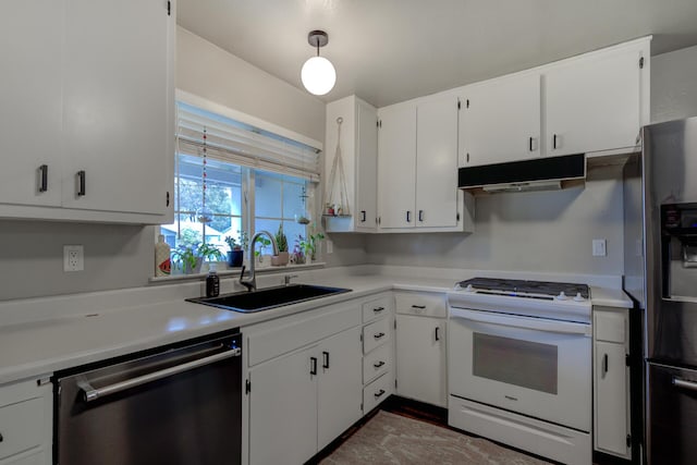 kitchen with gas range gas stove, stainless steel fridge with ice dispenser, a sink, under cabinet range hood, and dishwasher