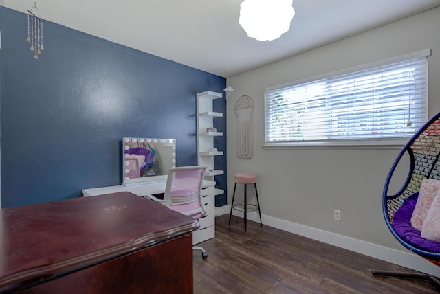 home office featuring baseboards and wood finished floors