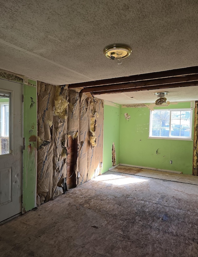 spare room featuring a textured ceiling