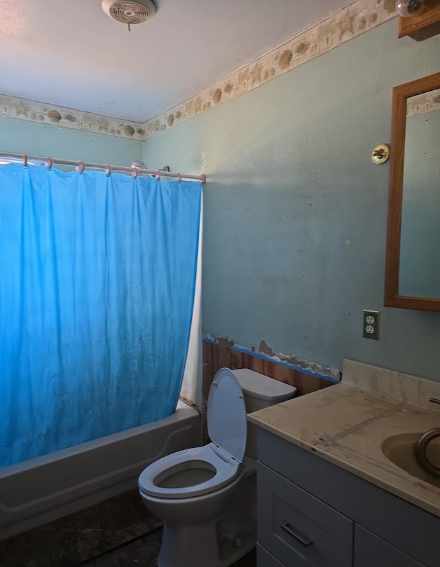 full bathroom with toilet, vanity, and shower / bath combination with curtain