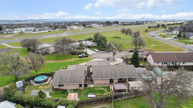 aerial view featuring a mountain view and a residential view