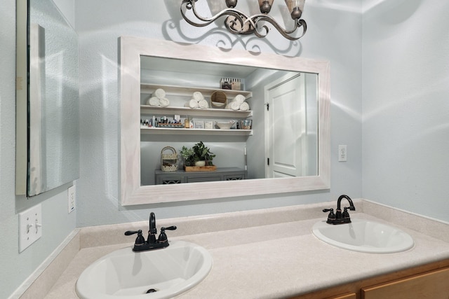 bathroom with a sink and double vanity