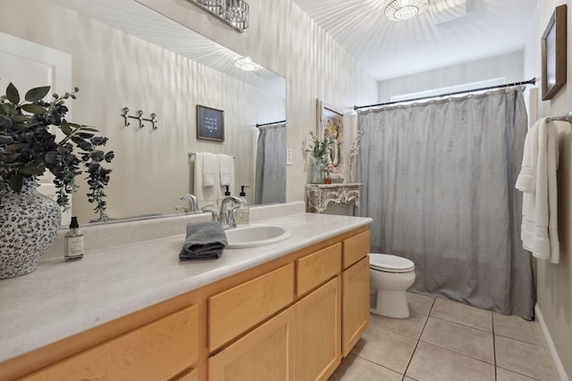 bathroom featuring tile patterned flooring, curtained shower, toilet, and vanity