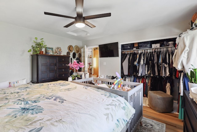 bedroom featuring a closet, ceiling fan, and wood finished floors