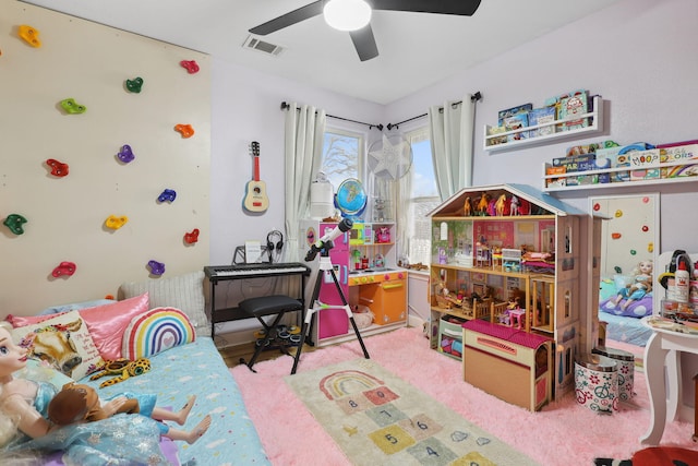 playroom with visible vents, carpet floors, and ceiling fan