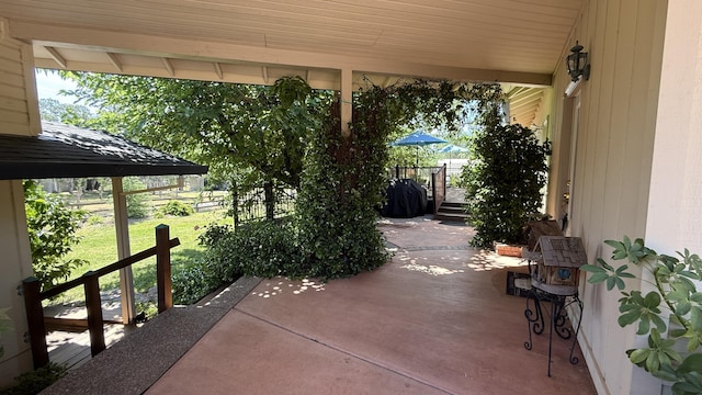 view of patio / terrace featuring fence