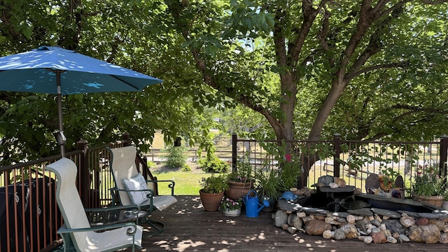 view of patio / terrace with fence and a deck
