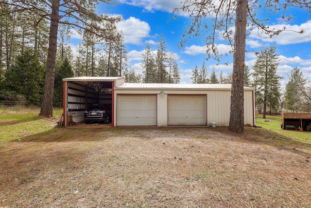 garage featuring a garage and driveway