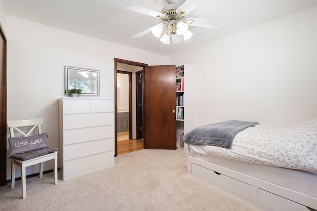 bedroom with light carpet and ceiling fan