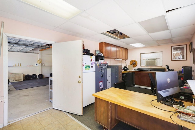 office space featuring cooling unit and a paneled ceiling