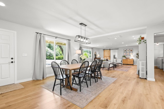 20190 Lupine Dr, Redding, CA 96002 - dining room with a barn door, light wood finished floors, baseboards, and recessed lighting