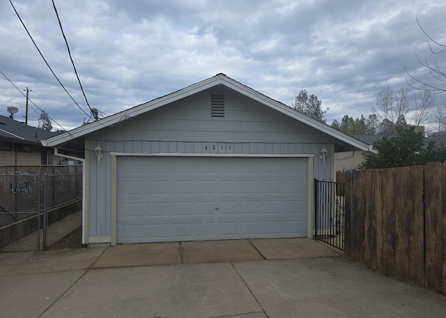detached garage with fence