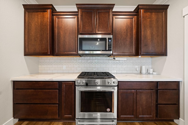 4461 Risstay Way, Shasta Lake, CA 96019 - kitchen with backsplash, light stone countertops, and appliances with stainless steel finishes
