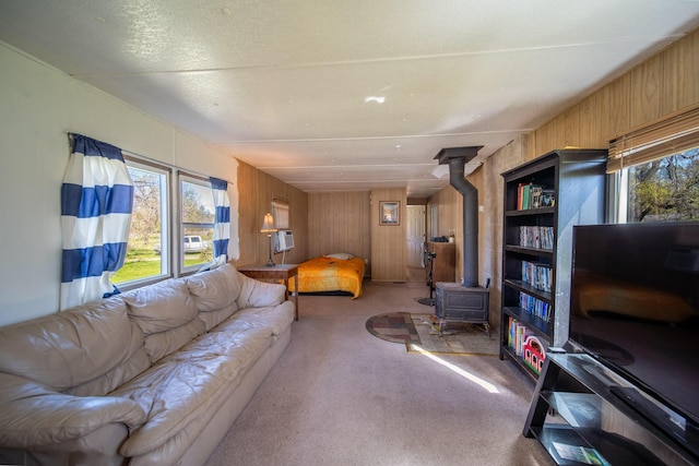 20292 Old Alturas Rd, Redding, CA 96003 - carpeted living area featuring wooden walls and a wood stove
