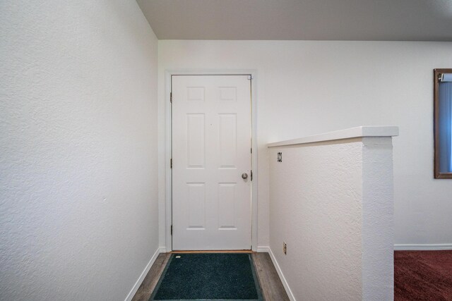 1200 Lema Rd, Redding, CA 96003 - doorway featuring dark wood-style floors and baseboards