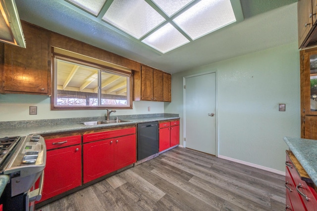 1200 Lema Rd, Redding, CA 96003 - kitchen with wood finished floors, red cabinetry, a sink, stove, and dishwasher