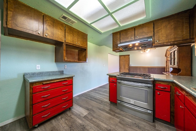 1200 Lema Rd, Redding, CA 96003 - kitchen featuring under cabinet range hood, visible vents, stainless steel gas stove, and dark wood finished floors