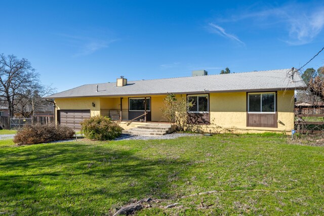 1200 Lema Rd, Redding, CA 96003 - ranch-style home featuring a front yard, a garage, and stucco siding