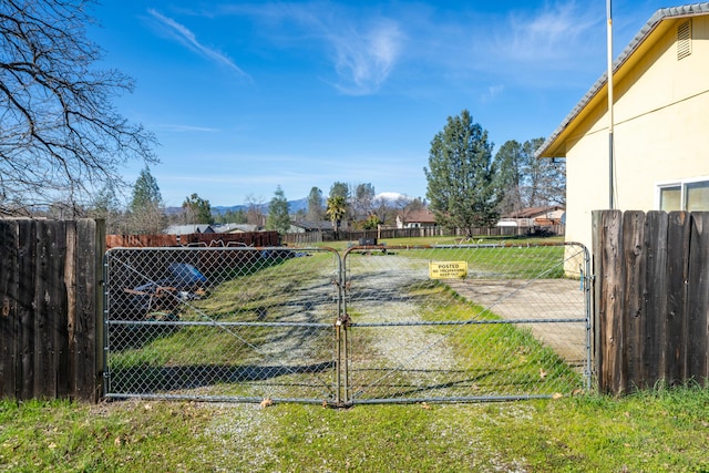 1200 Lema Rd, Redding, CA 96003 - view of yard with a gate and fence