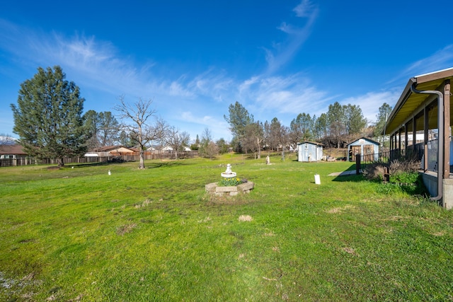 1200 Lema Rd, Redding, CA 96003 - view of yard with fence, an outdoor structure, and a shed