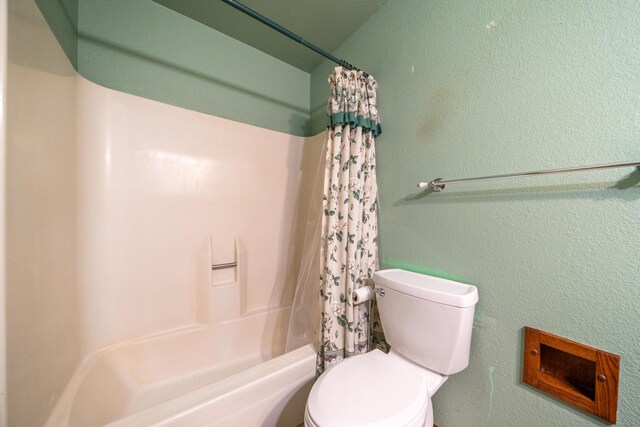 1200 Lema Rd, Redding, CA 96003 - bathroom featuring shower / bath combination with curtain, toilet, and a textured wall