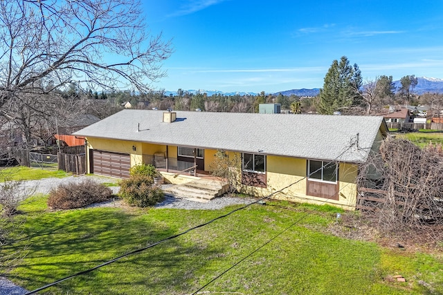 1200 Lema Rd, Redding, CA 96003 - single story home with stucco siding, a front lawn, driveway, fence, and a garage