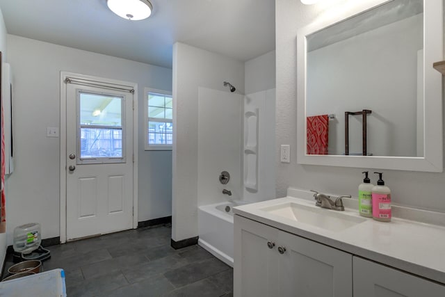 full bath featuring shower / bath combination, baseboards, and vanity