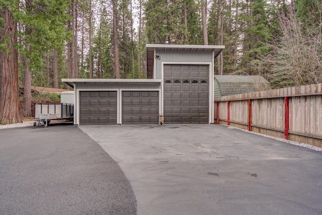 garage with fence