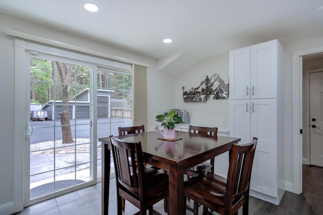 dining area featuring baseboards, wood finished floors, and recessed lighting