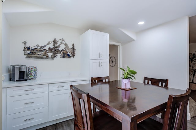 dining area featuring dark wood-style floors, lofted ceiling, and recessed lighting