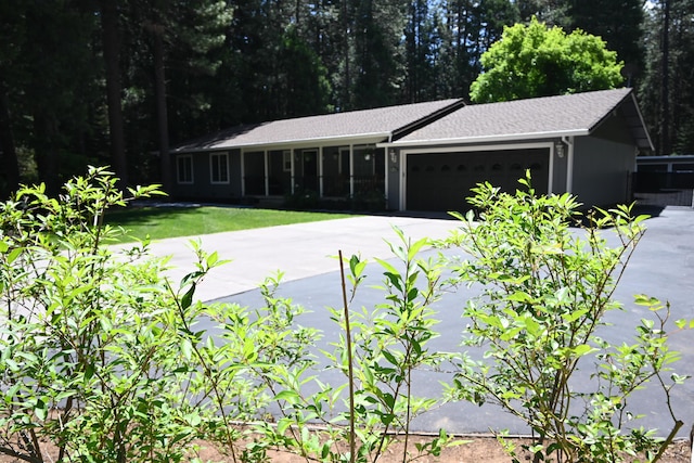 37105 Sapphire Rd, Burney, CA 96013 - view of front of home with a garage, driveway, and a front yard