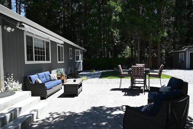 37105 Sapphire Rd, Burney, CA 96013 - view of patio featuring outdoor lounge area, outdoor dining area, and an outbuilding