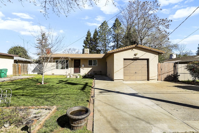 3235 Sharon Ave, Anderson, CA 96007 - view of front of property featuring driveway, stucco siding, fence, an attached garage, and a front lawn
