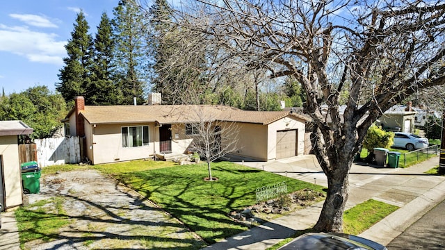 3235 Sharon Ave, Anderson, CA 96007 - single story home featuring a garage, concrete driveway, stucco siding, and fence